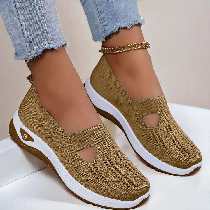 Lightweight women's slip-on sneakers, ideal for summer; features arch support, breathable fabric, and cushioning.