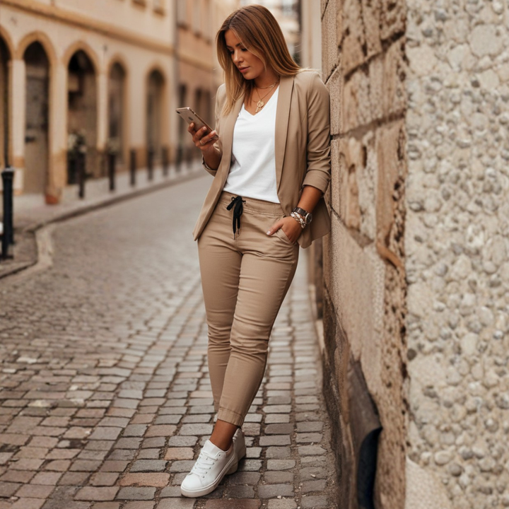 Elegant women's ruched sleeve blazer & jogger two-piece set. Modern smart casual style for sophisticated women.