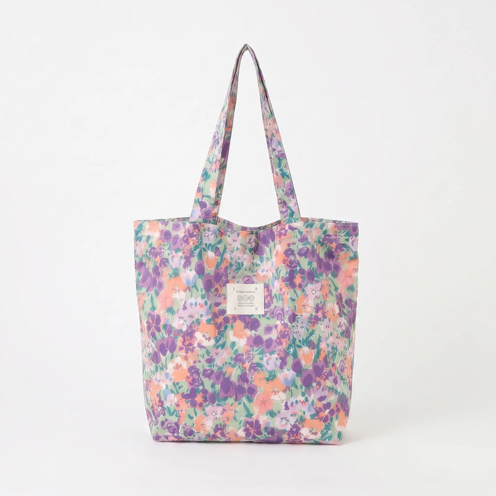 Soft shoulder women's tote bag showcasing a lovely floral print. A colorful, large fashion accessory for women.
