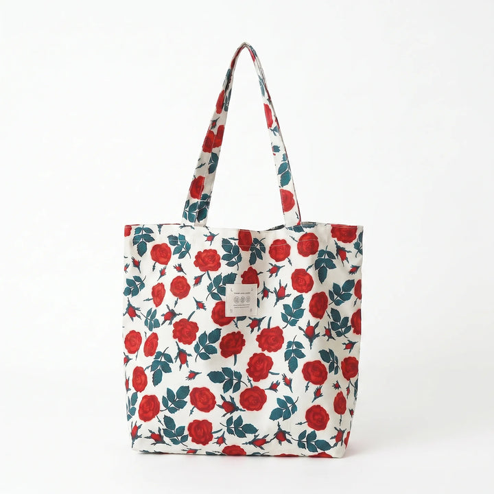 Stylish women's colorful tote bag with a vibrant floral print and soft shoulder strap, a spacious fashion accessory.