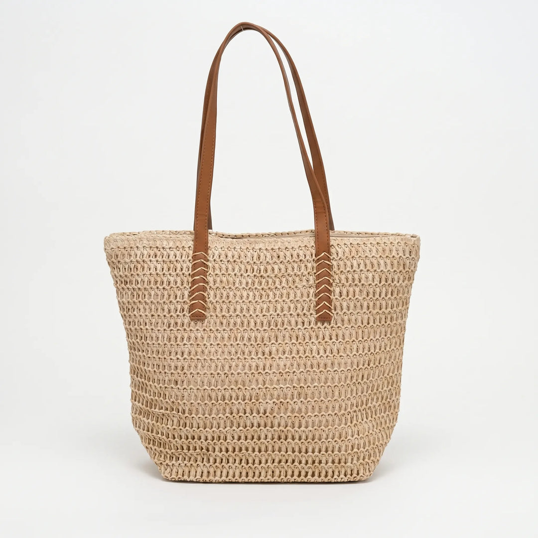 Elegant natural-tone woven tote bag for women. Spacious shoulder bag, ideal as a beach or everyday carryall.