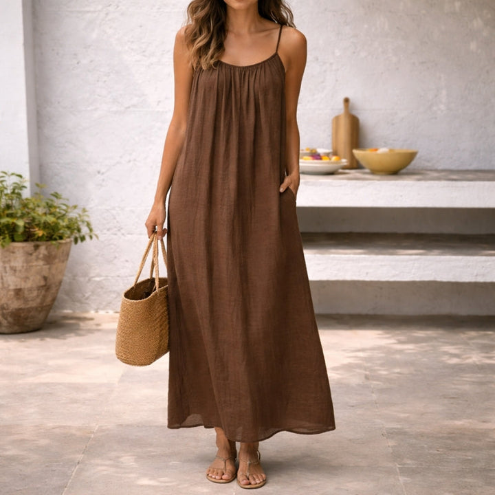Women's spaghetti strap maxi sundress in a vibrant summer color, perfect for beach or vacation.