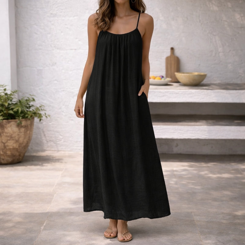 Stylish women's summer sundress with delicate spaghetti straps, a comfortable and chic vacation essential.