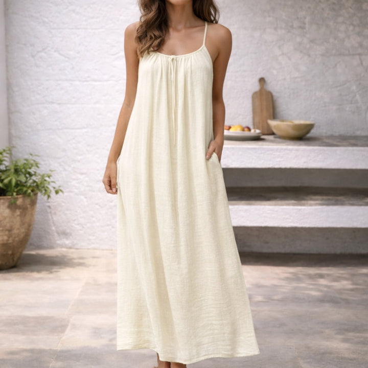Women's sleeveless maxi dress with thin spaghetti straps, a must-have for summer beach outings.