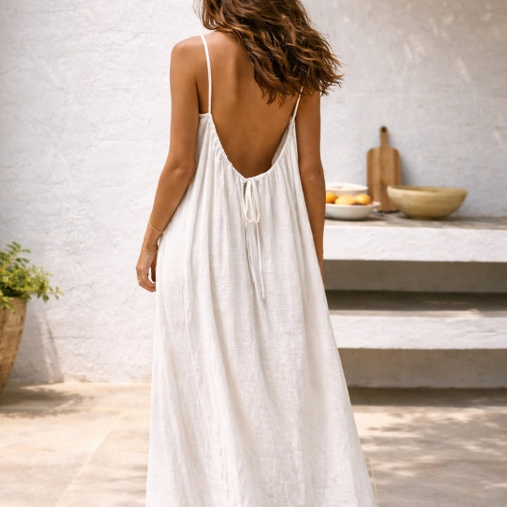 Lightweight women's maxi sundress with adjustable spaghetti straps, featuring convenient side pockets.