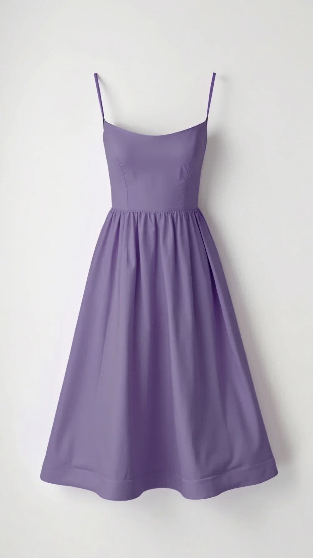 Stylish women's spaghetti strap A-line midi dress. Features a scoop neck, ideal for various summer occasions.