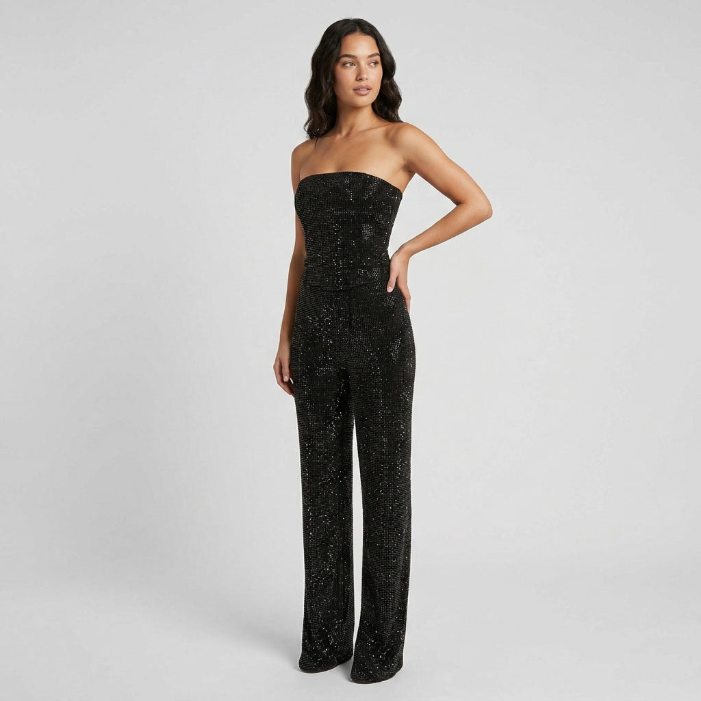 Trendy women's two-piece glitter crop top and high-waist denim jeans outfit for night out.