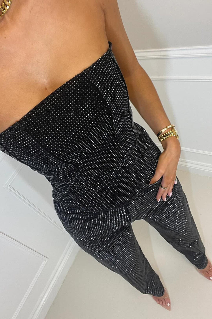 Sparkling women's crop top & high-waist jeans set for a dazzling evening wear look.