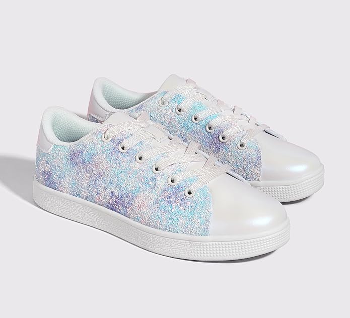 Close-up of women's sparkling glitter lace-up sneakers, showcasing texture & style.