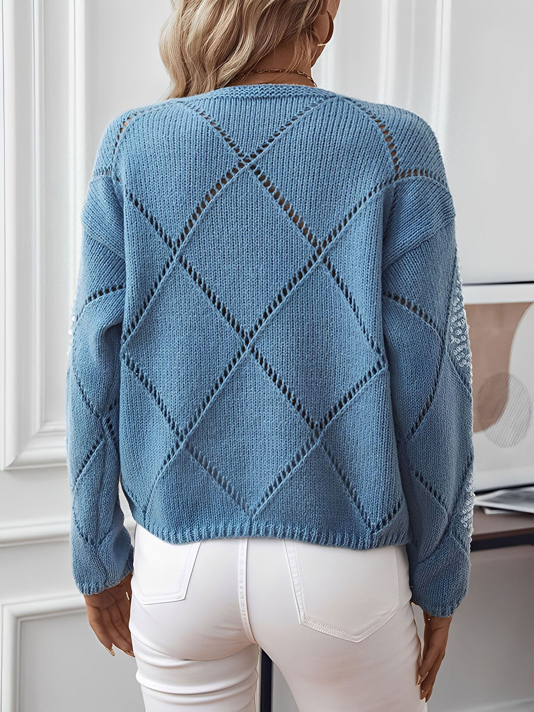 Women's sequin knit sweater featuring a shimmering diamond pattern & crew neck.