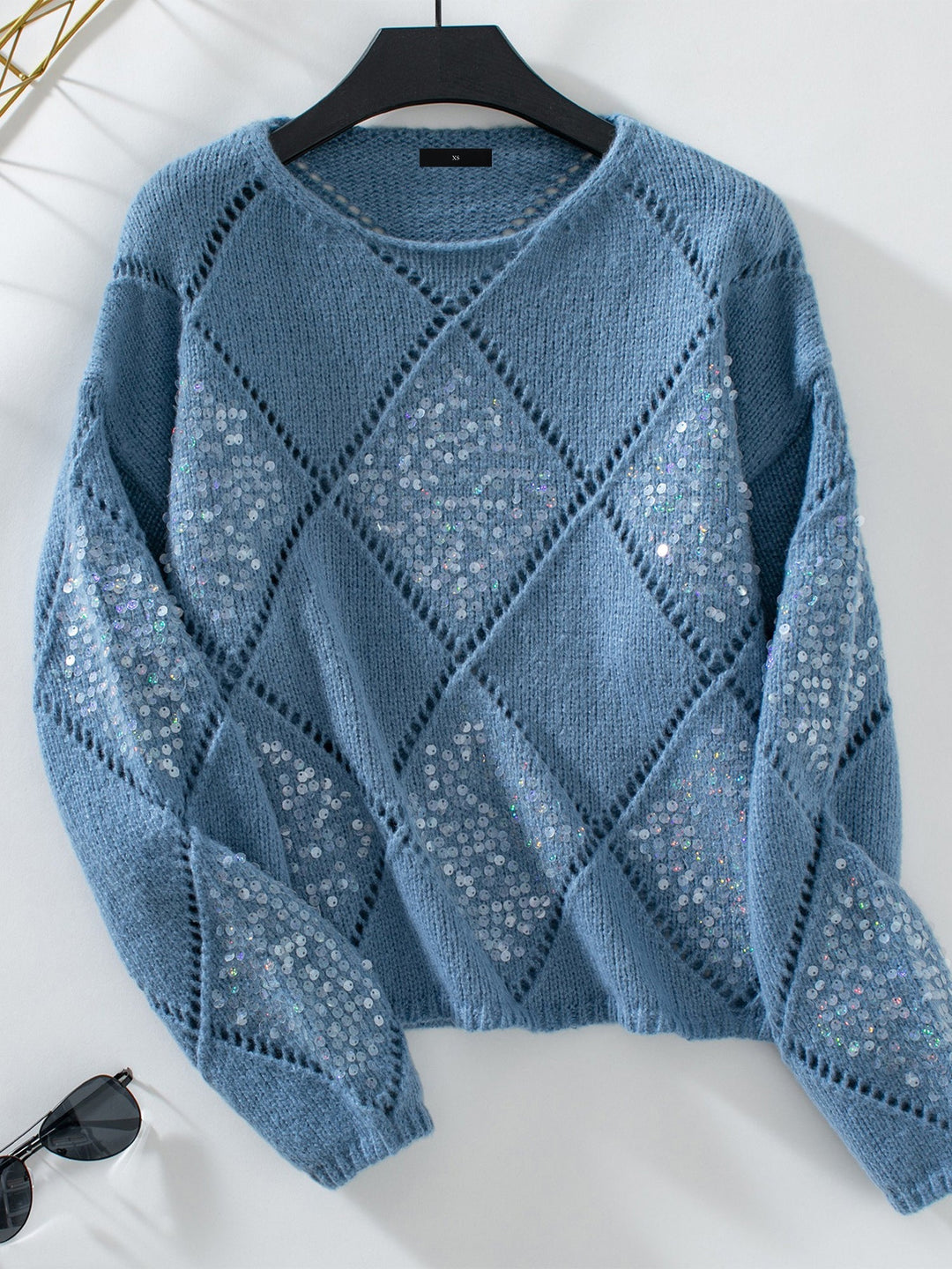Sparkling women's sequin knit sweater, elegant crew neck for festive occasions.