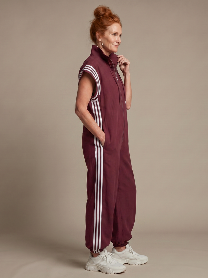 Full-length women's jumpsuit, side stripe detail, zip front, comfortable sporty chic fashion.
