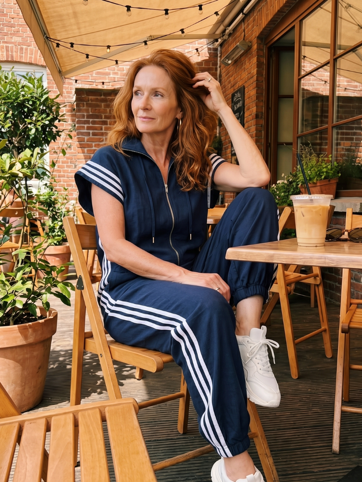 Statement piece women's full-length jumpsuit, sporty side stripe, versatile for occasions.