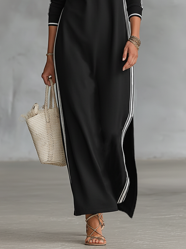 Full-length women's maxi dress with long sleeves, stand collar, and trendy contrast trim detail.