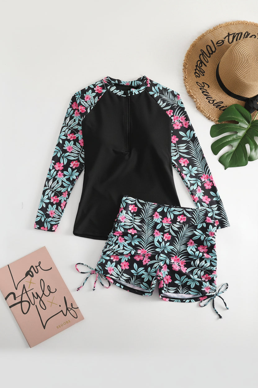 Vibrant tropical two-piece rashguard swimsuit for women, designed for active wear, beach, and sun protection.