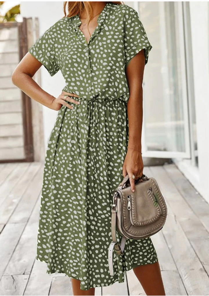 Flowy spotted midi dress with button-down front & flutter sleeves.