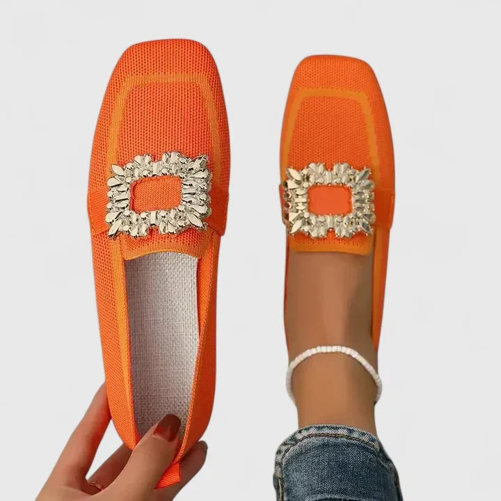 Stylish women's square toe flat mules with a decorative rhinestone buckle. Easy slip-on everyday fashion shoes.