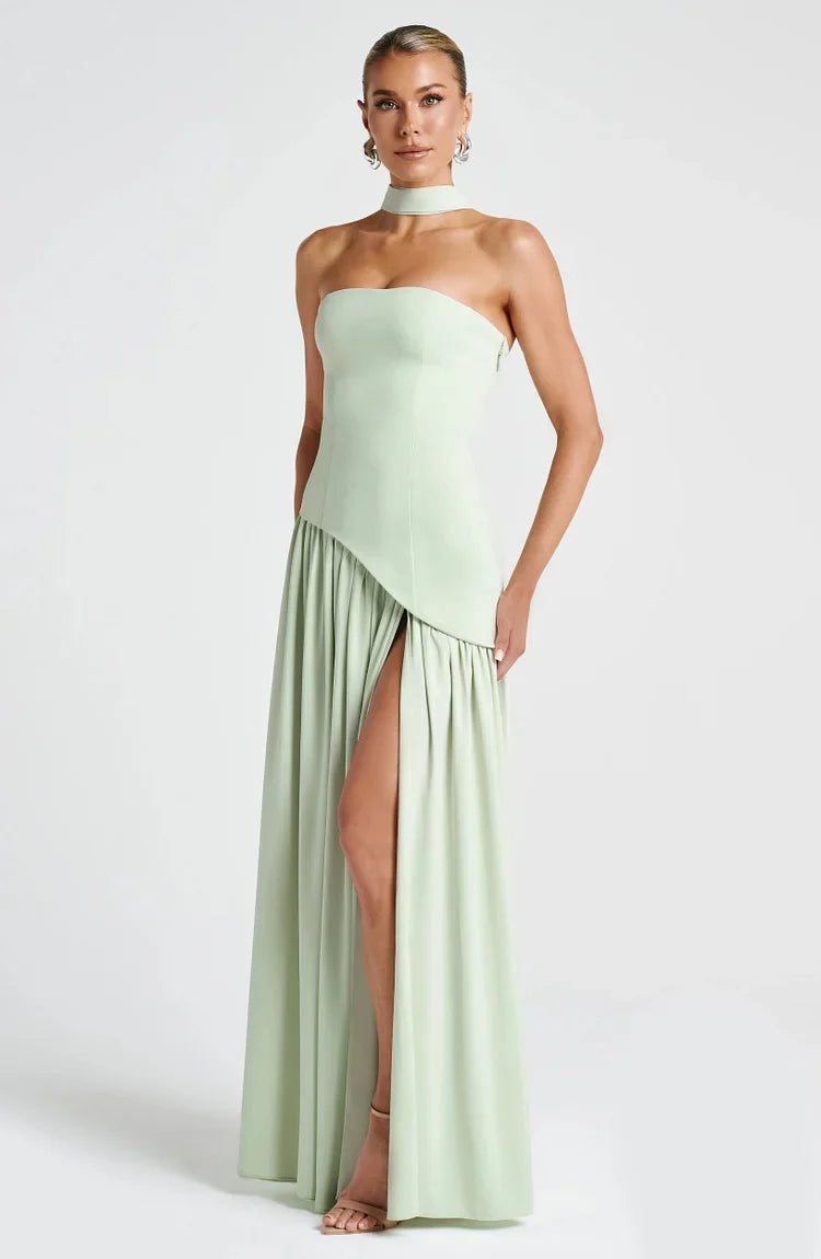 Modern strapless asymmetric hem maxi dress, a chic choice for any occasion.