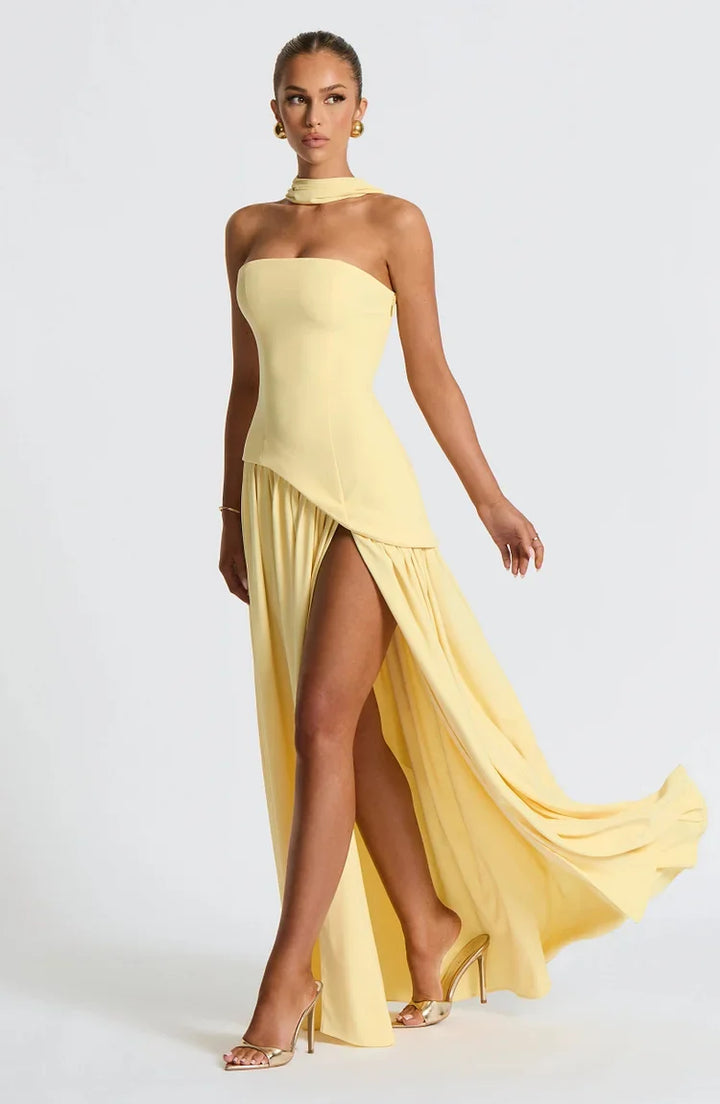 Flattering strapless asymmetric maxi dress, designed for elegance and style.
