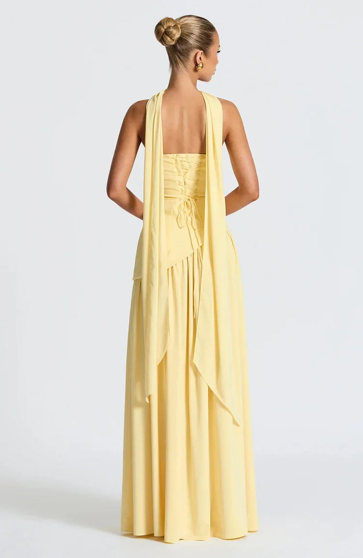 Classic strapless maxi dress with a modern asymmetric hem for evening events.