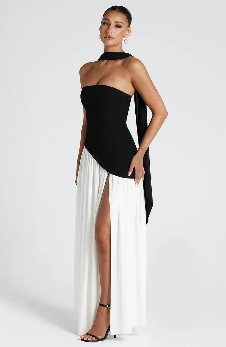 Flowing strapless asymmetric hem maxi dress, a sophisticated choice for evening.
