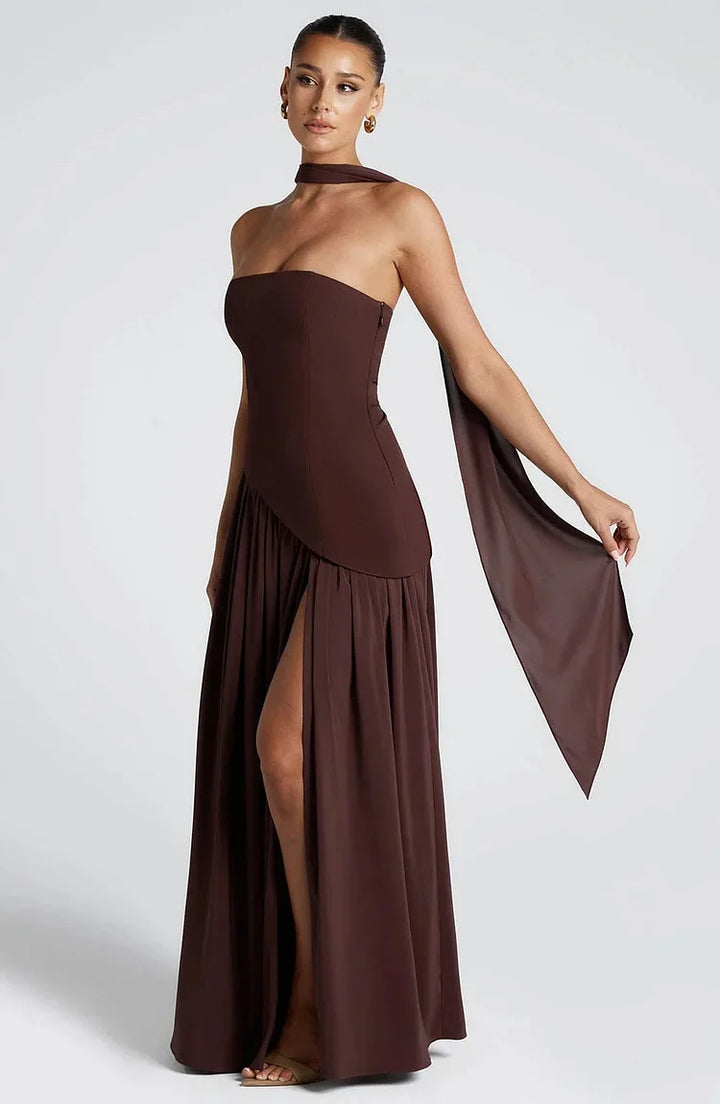 Summer-ready strapless asymmetric hem maxi dress, elegant for special events.
