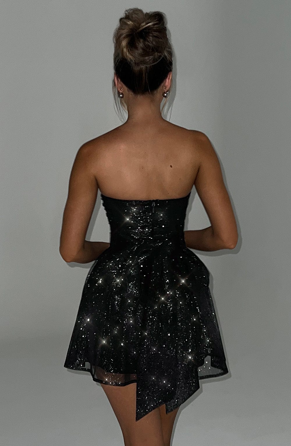 Dazzling strapless glitter mini skater dress for women. Ideal homecoming, party, or evening cocktail dress.