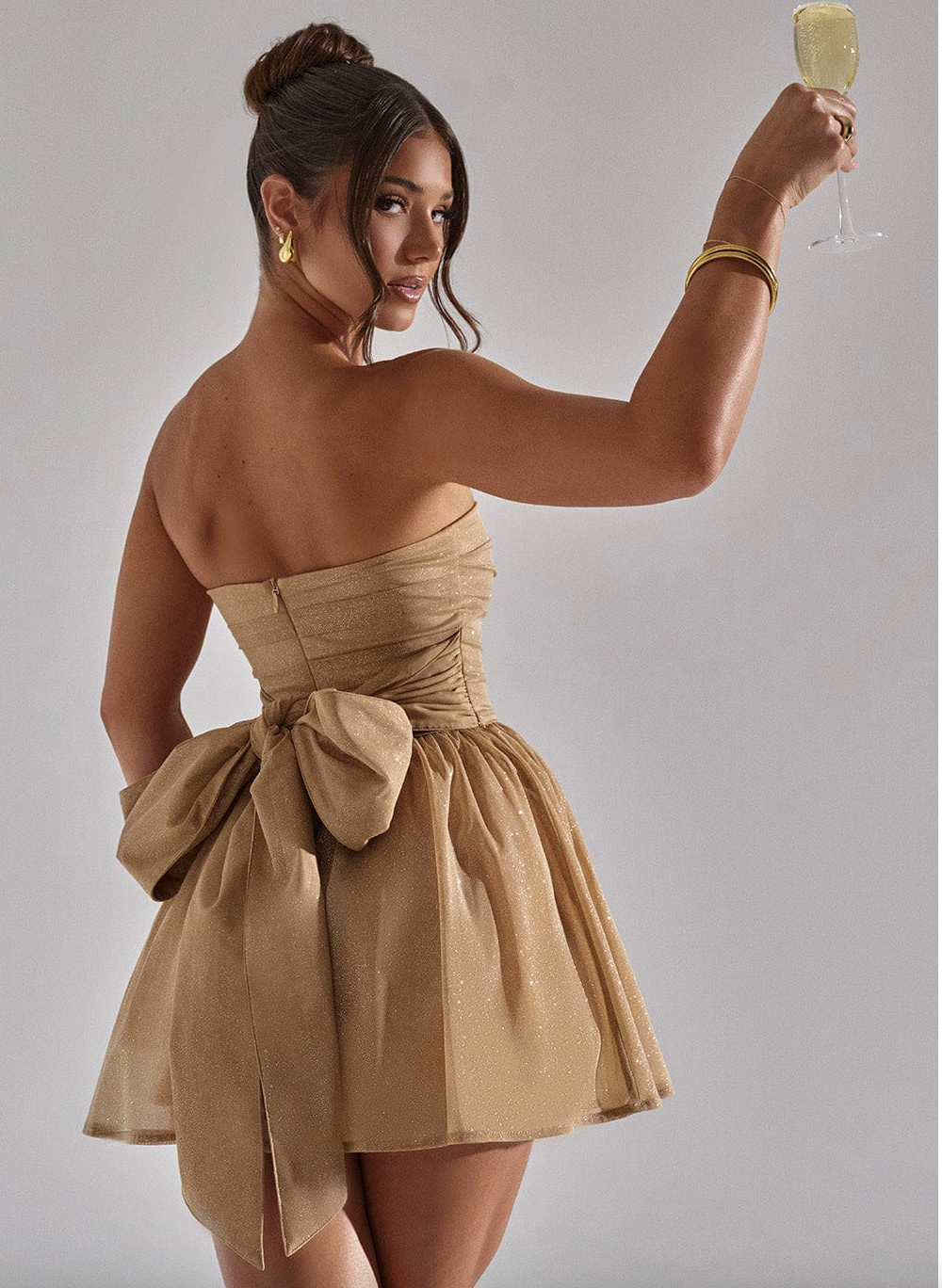 Sparkling women's strapless glitter skater mini dress. Great for homecoming, evening events, and party wear.