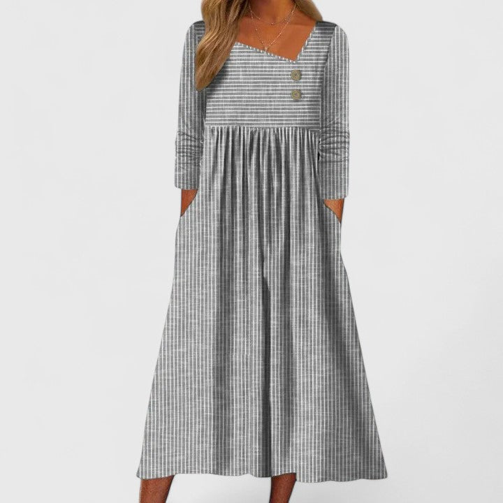 Women's striped A-line midi dress with long sleeves, button details & pockets, perfect for casual everyday wear.