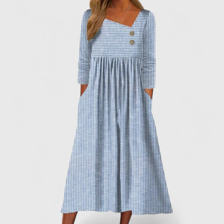 Elegant women's striped midi dress with long sleeves, functional pockets & button details, ideal for versatile everyday style.