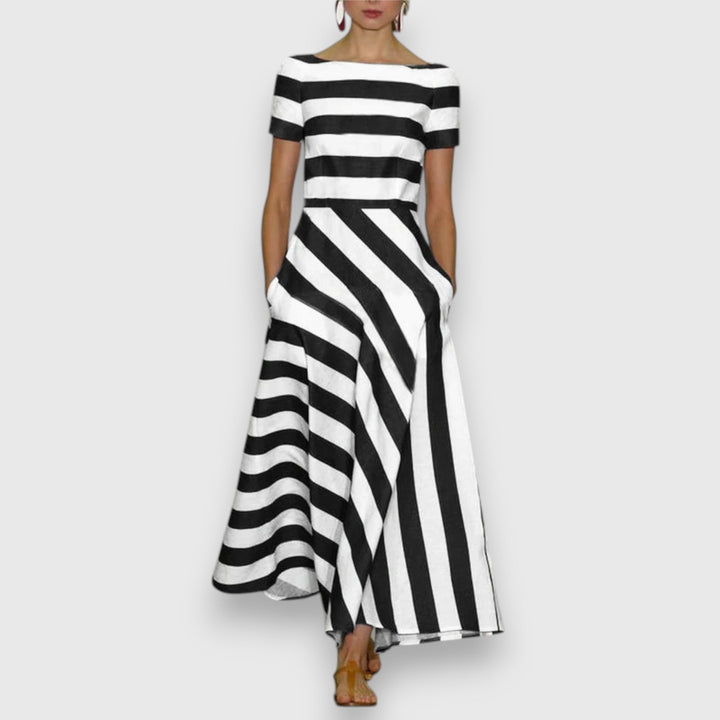 Comfortable women's short sleeve striped midi dress with boat neck & pockets. Ideal for casual spring & summer fashion.