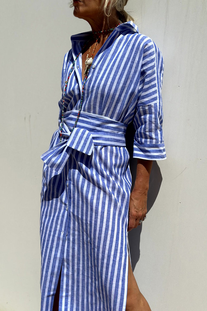 Women's fashion striped midi dress with an oversized fit, button-down front, and classic collar. Spring style.