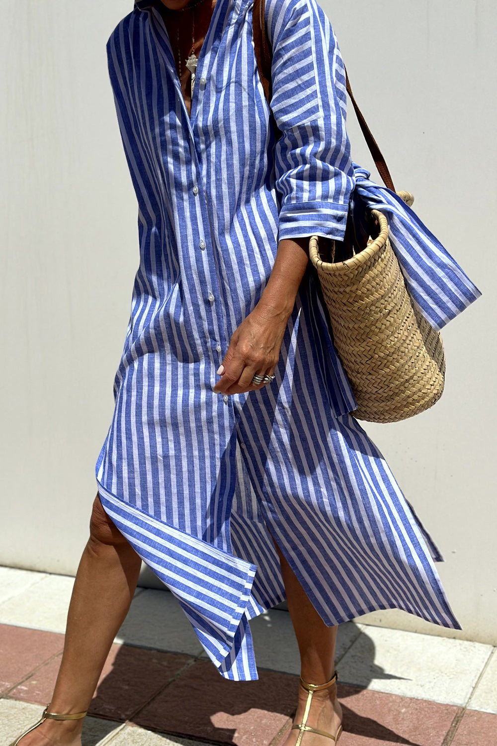 Elegant casual striped oversized midi dress for women. Features a stylish collared button-down design.