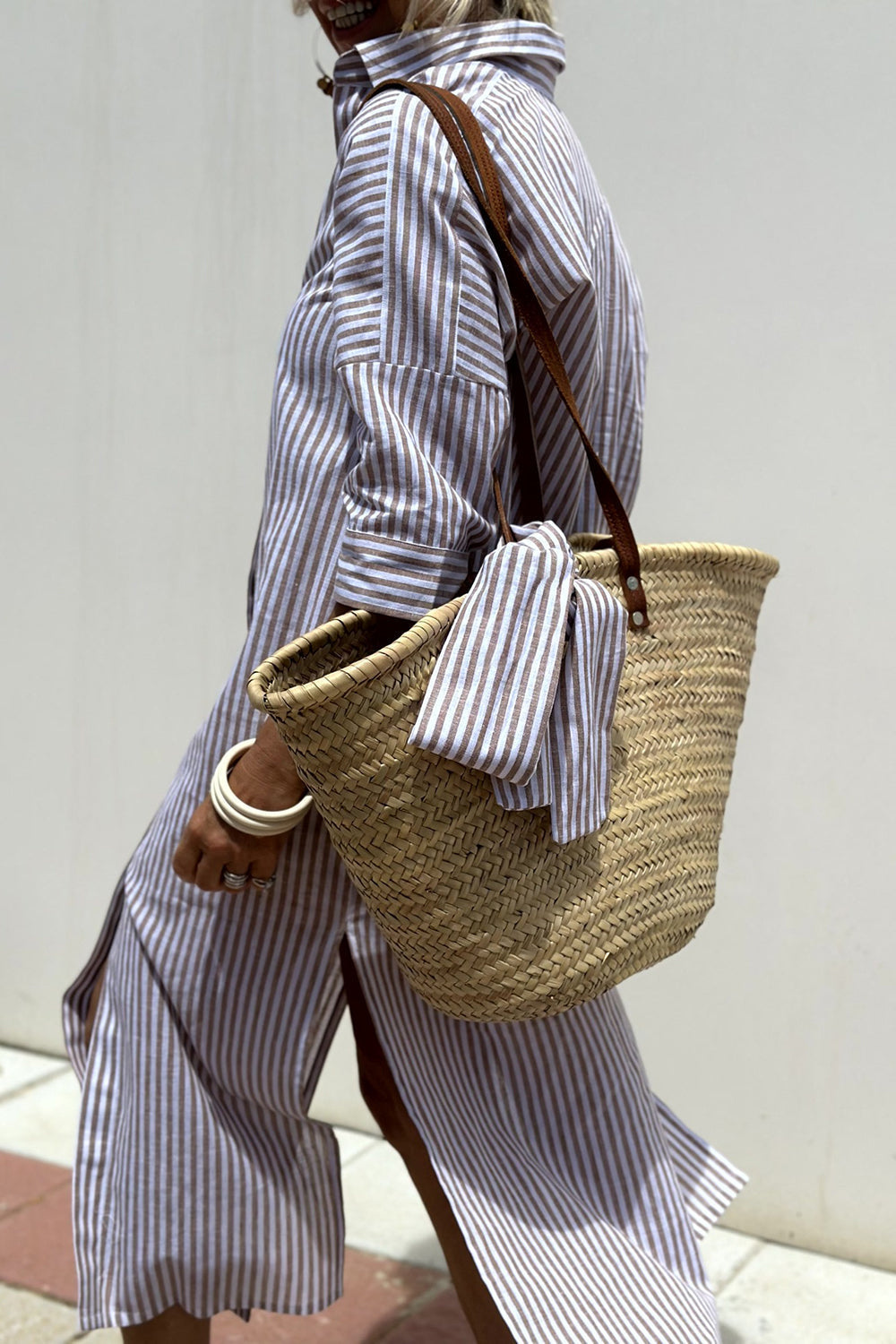 Trendy women's oversized striped midi dress. Collared, button-down, and perfect for a stylish casual summer day.