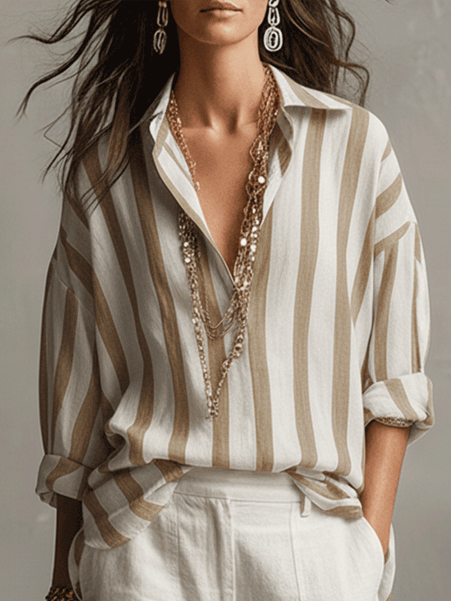 Versatile women's striped button-up shirt, long sleeve, ideal for fashion-forward looks.