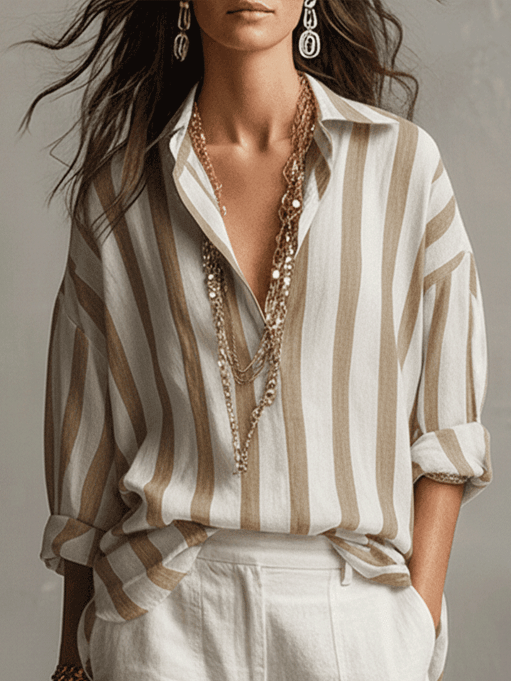 Versatile women's striped button-up shirt, long sleeve, ideal for fashion-forward looks.