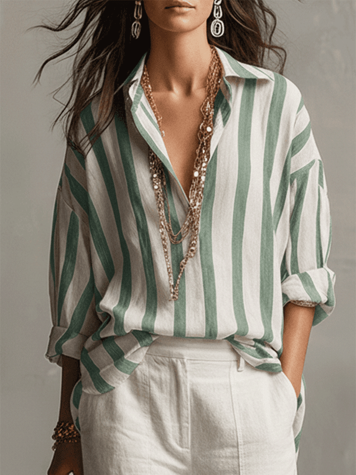Stylish women's long sleeve striped blouse, button-front design, great for casual elegance.