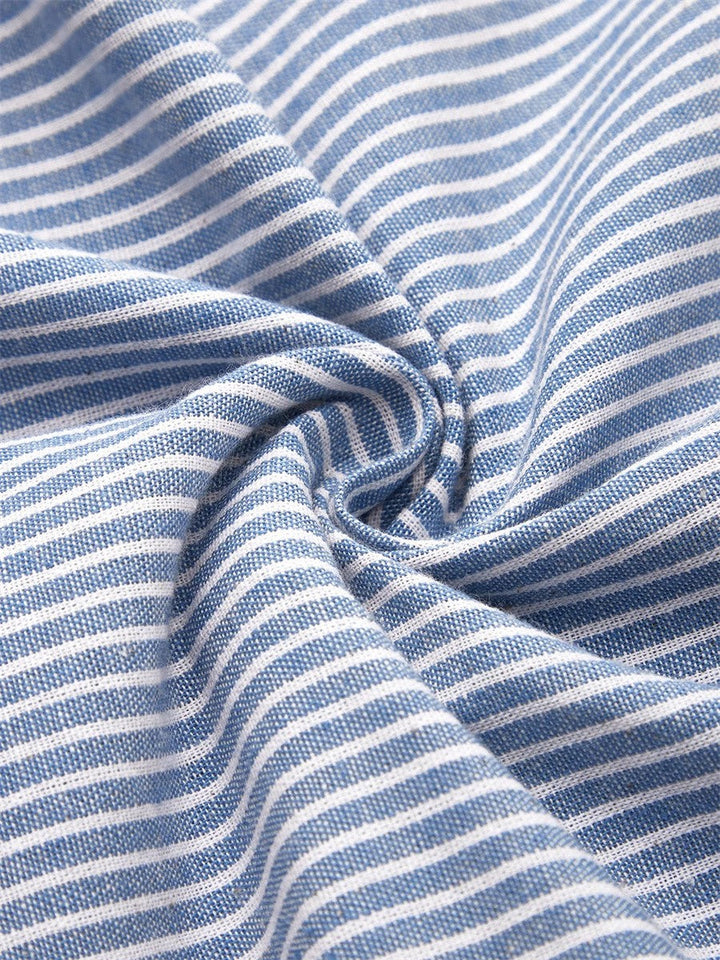 Chic women's striped midi dress featuring decorative side button detail, great for casual outings & summer style.