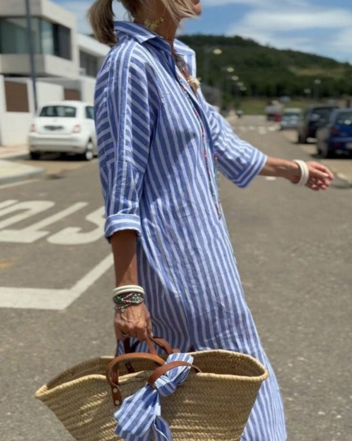 Elegant women's striped midi shirt dress featuring practical pockets, a stylish choice for spring & summer.