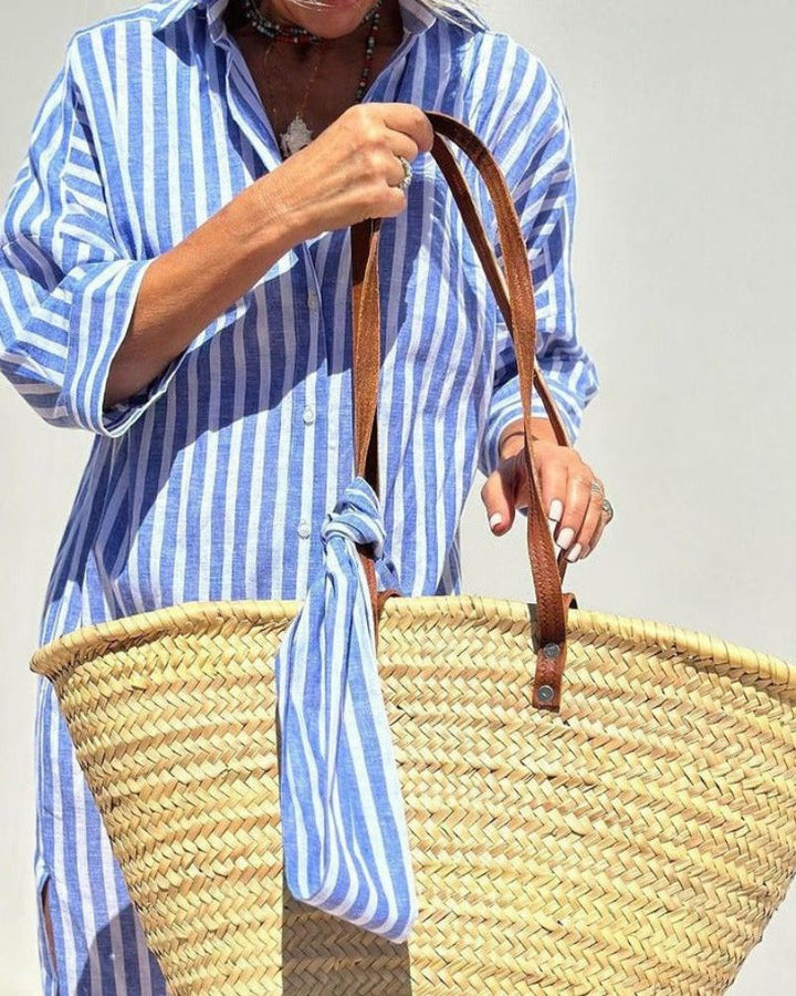 Women's versatile striped shirt dress, a comfortable midi with convenient pockets for casual day wear.