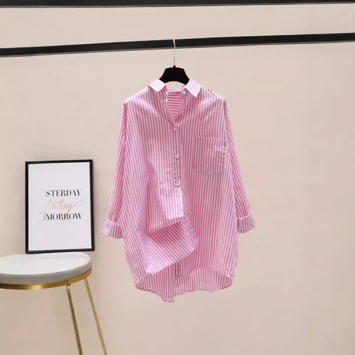 Versatile women's oversized striped button down shirt, ideal for preppy or casual looks.