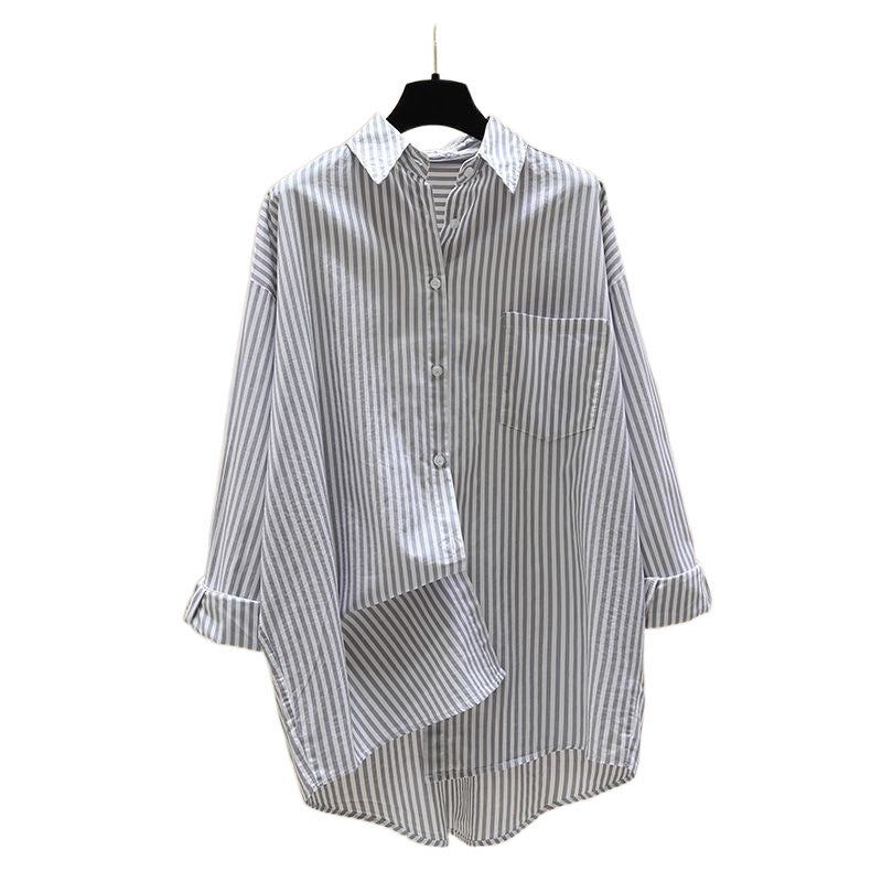 Effortless women's oversized striped button down shirt, a versatile piece for summer & fall style.