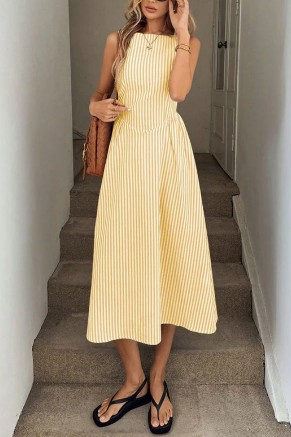 Elegant women's halter neck midi dress featuring chic stripes & flowy pleats, ideal for summer style.