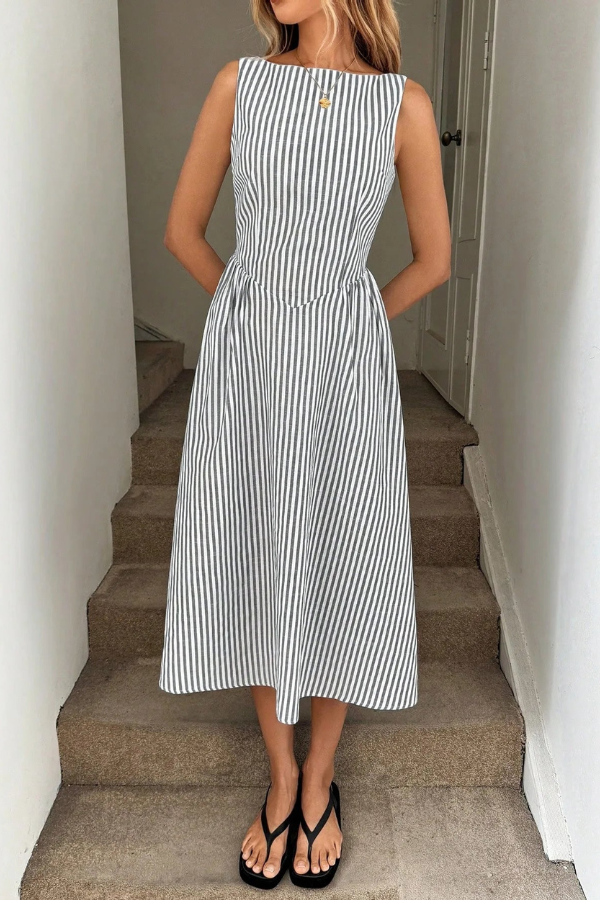 Chic women's striped pleated halter neck midi dress. Ideal summer dress, vacation wear, casual elegance.