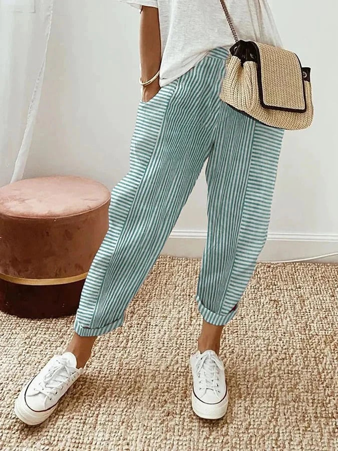Comfortable women's striped trousers, relaxed fit with elastic waist, ideal for casual summer outfits.
