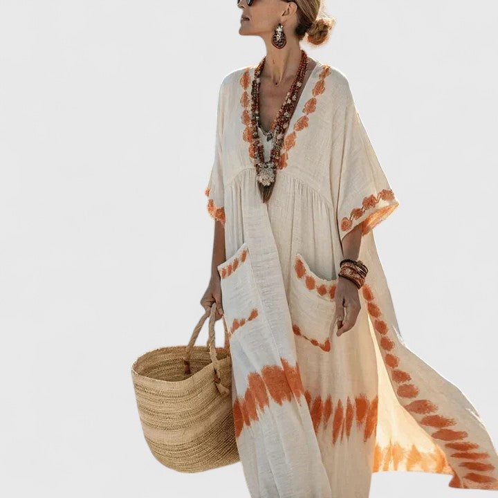 Comfortable women's striped V-neck maxi dress, featuring practical pockets and a relaxed fit.