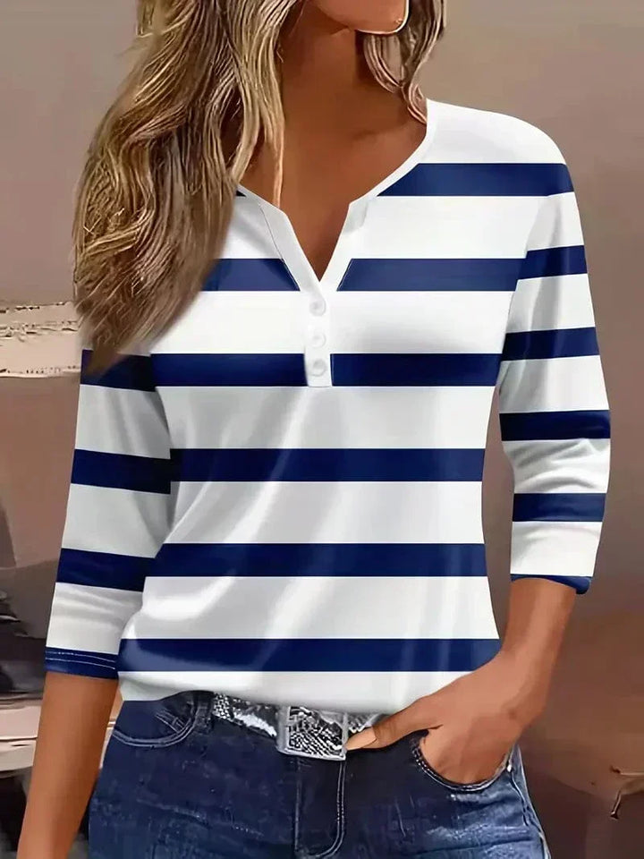 Fashionable women's short sleeve V-neck shirt, featuring a chic striped pattern for spring.