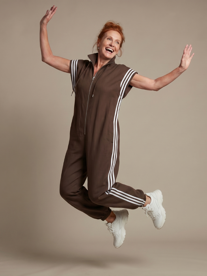 Smart workwear women's striped one-piece with a discreet zip front closure.