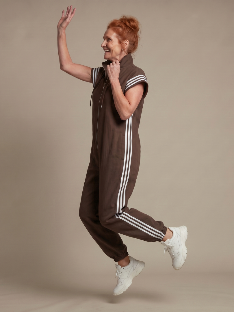 Comfortable and stylish striped women's jumpsuit with an accessible zip front.