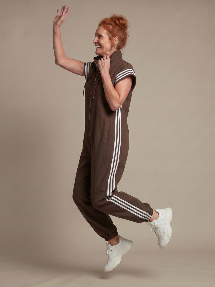 Comfortable and stylish striped women's jumpsuit with an accessible zip front.